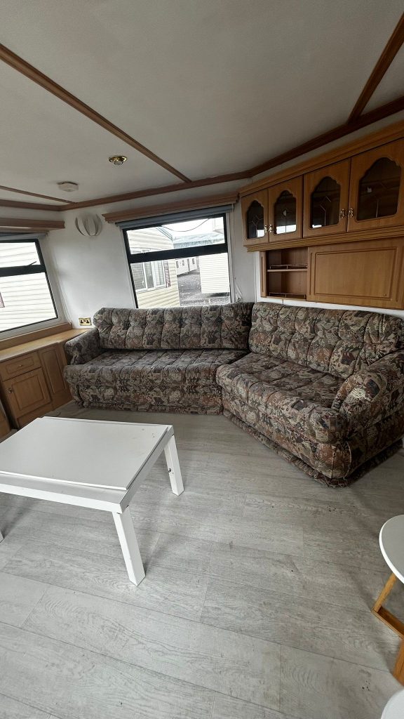 Static caravan sofas and white coffee table