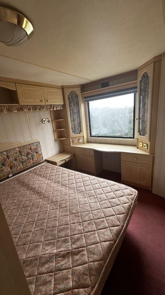 Double bed in static caravan with dressing table
