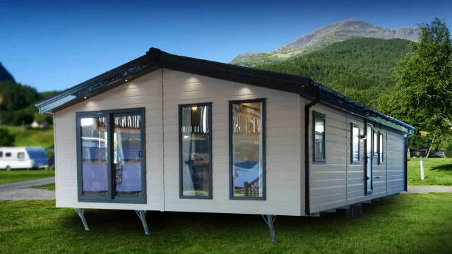 large clad lodge with patio doors and two large front windows